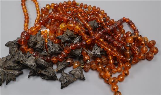 Six amber bead necklaces include five facetted and one other necklace.